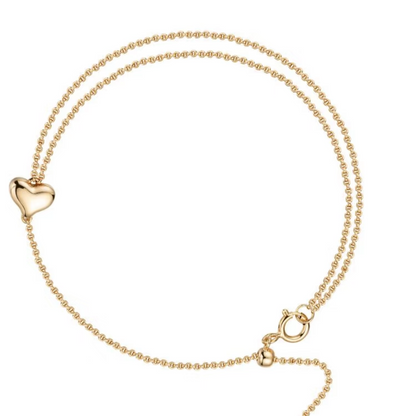 An 18K gold vermeil 925 sterling silver heart bracelet featuring a 3D puffy heart charm connected to an asymmetric double-strand chain with an adjustable spring clasp on a white background